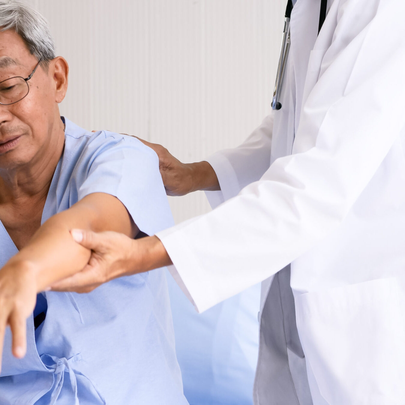 Physical therapist doing physical therapy for adult patient at h