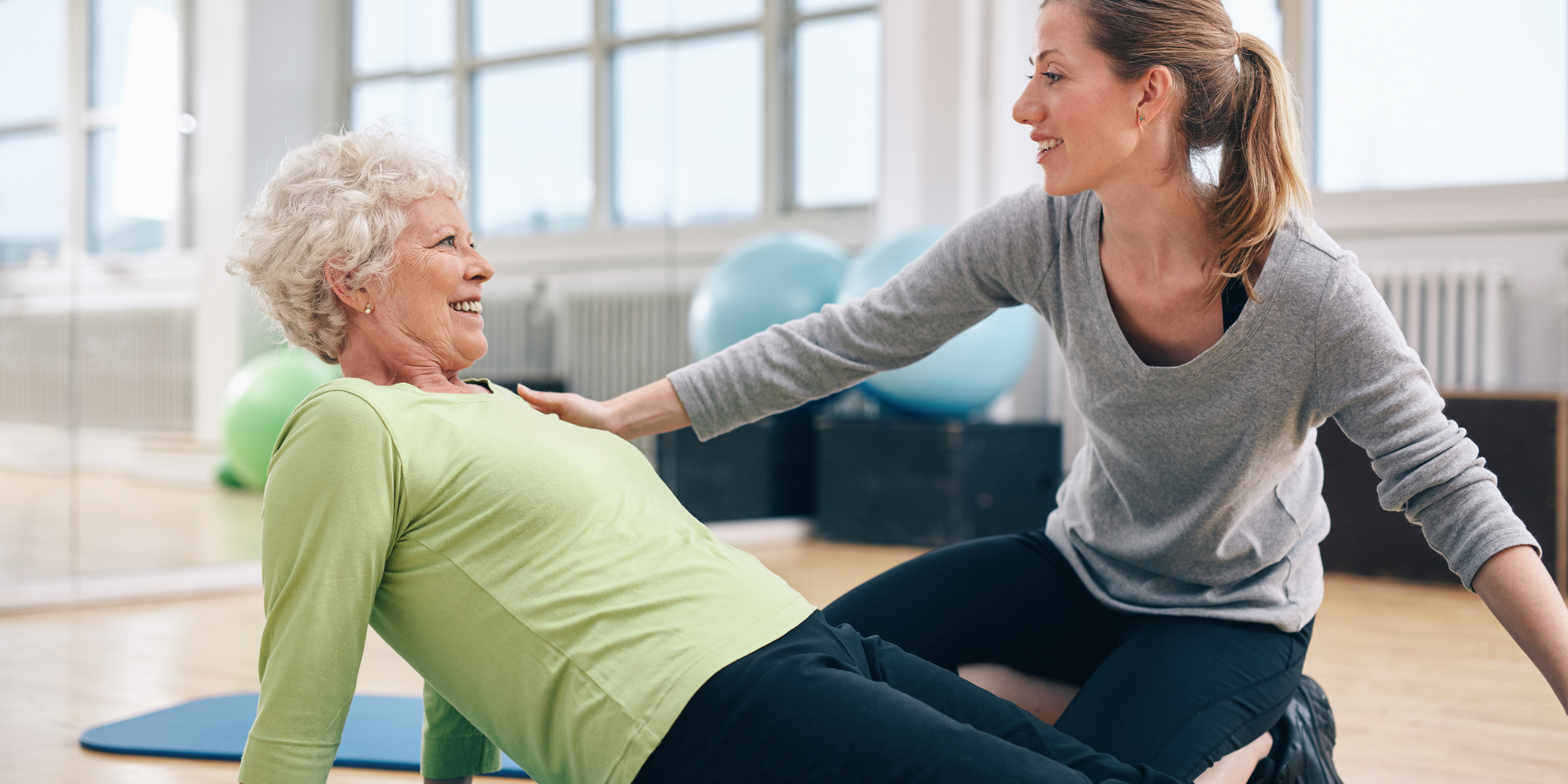 A senior smiling at Synergy Physical Therapy and Wellness experiencing the benefits of Physical Therapy for Older Adults